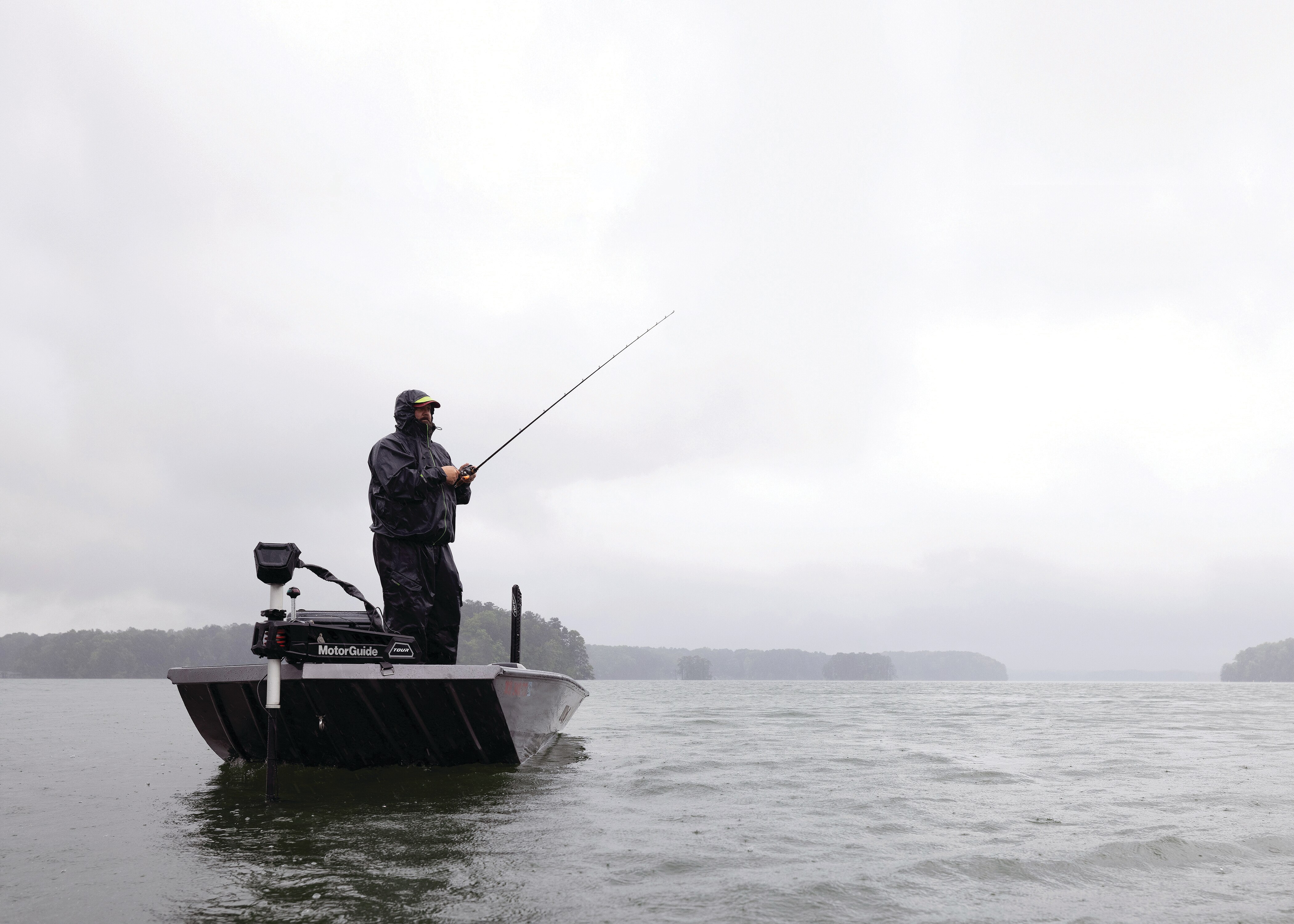 Man fishing on Alumacraft Bass and Crappie black boat