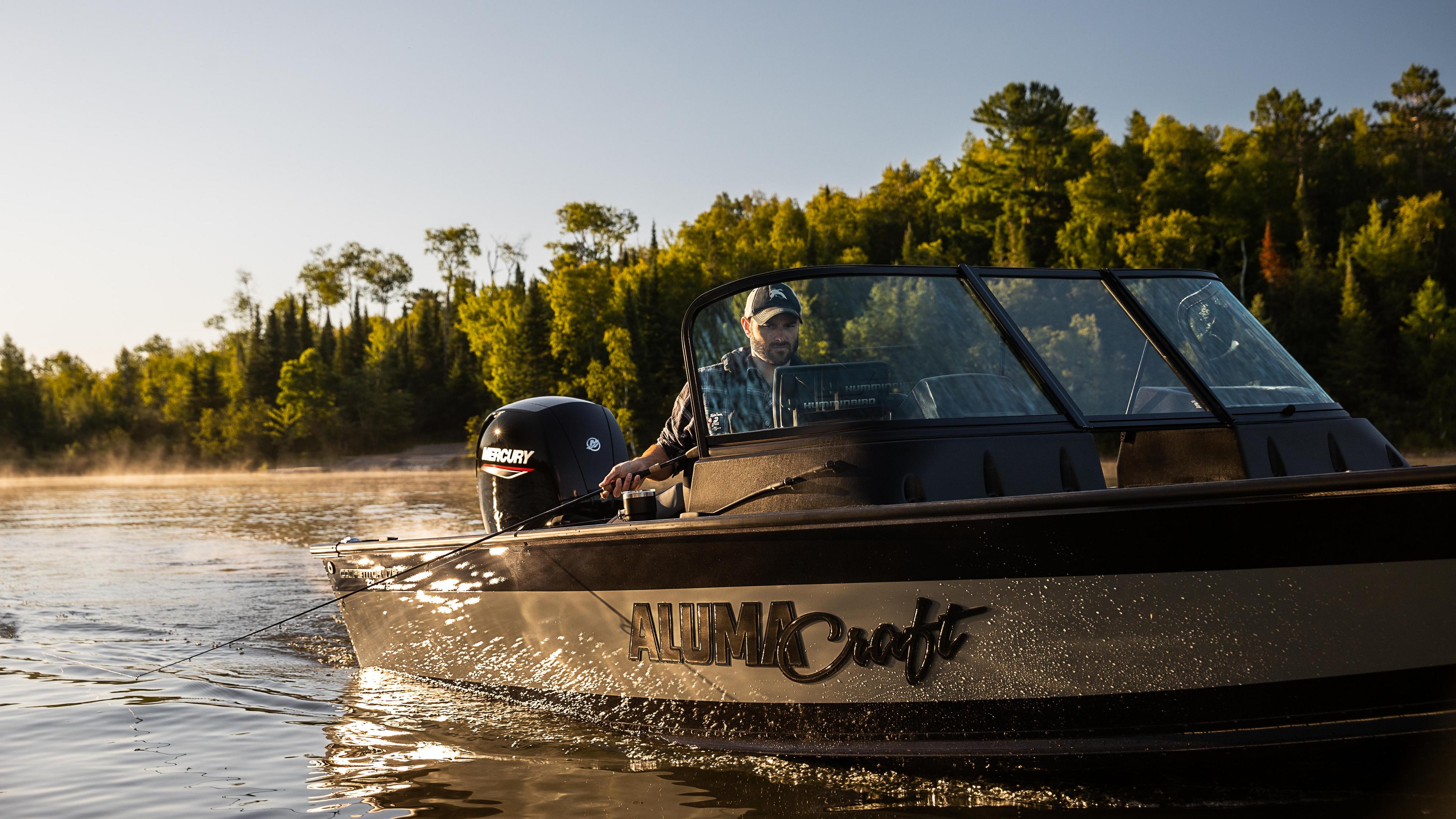 Man fishing on his Alumacraft aluminum boat on a fine summer's day