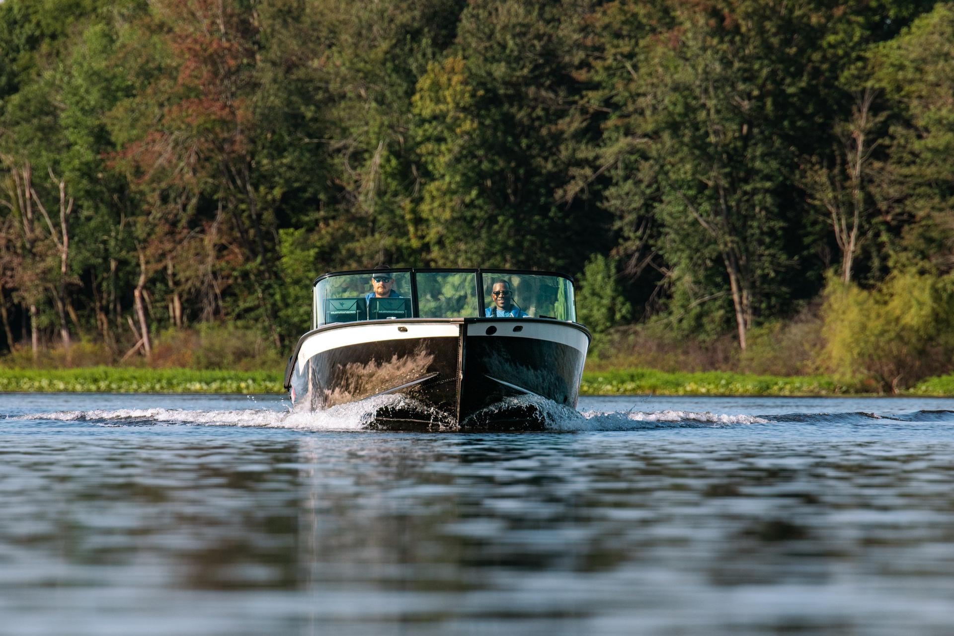 An Alumacraft aluminum boat designed for sport fishing in calm waters.