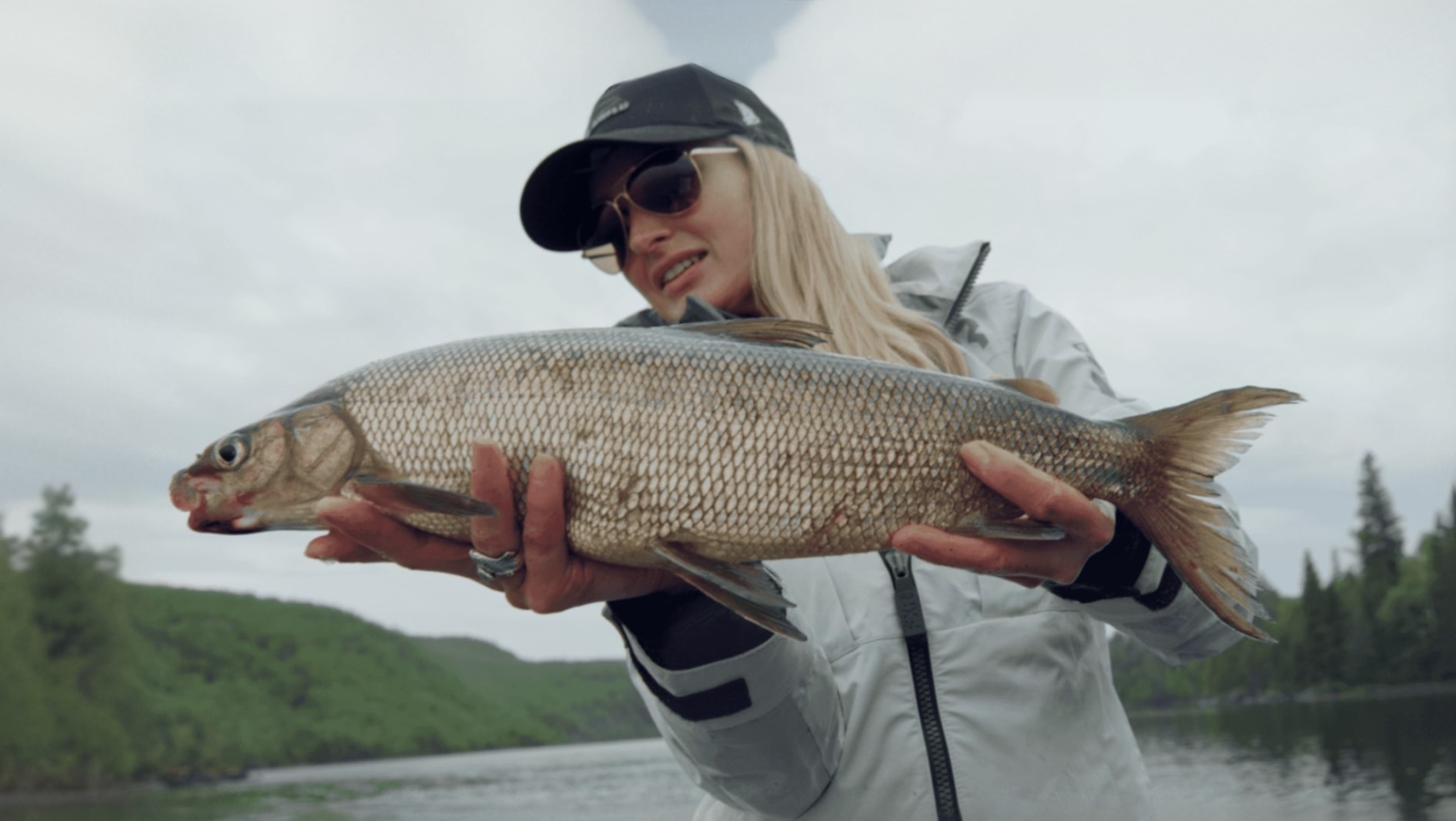 Ambassador Rebekka Redd holding a fish