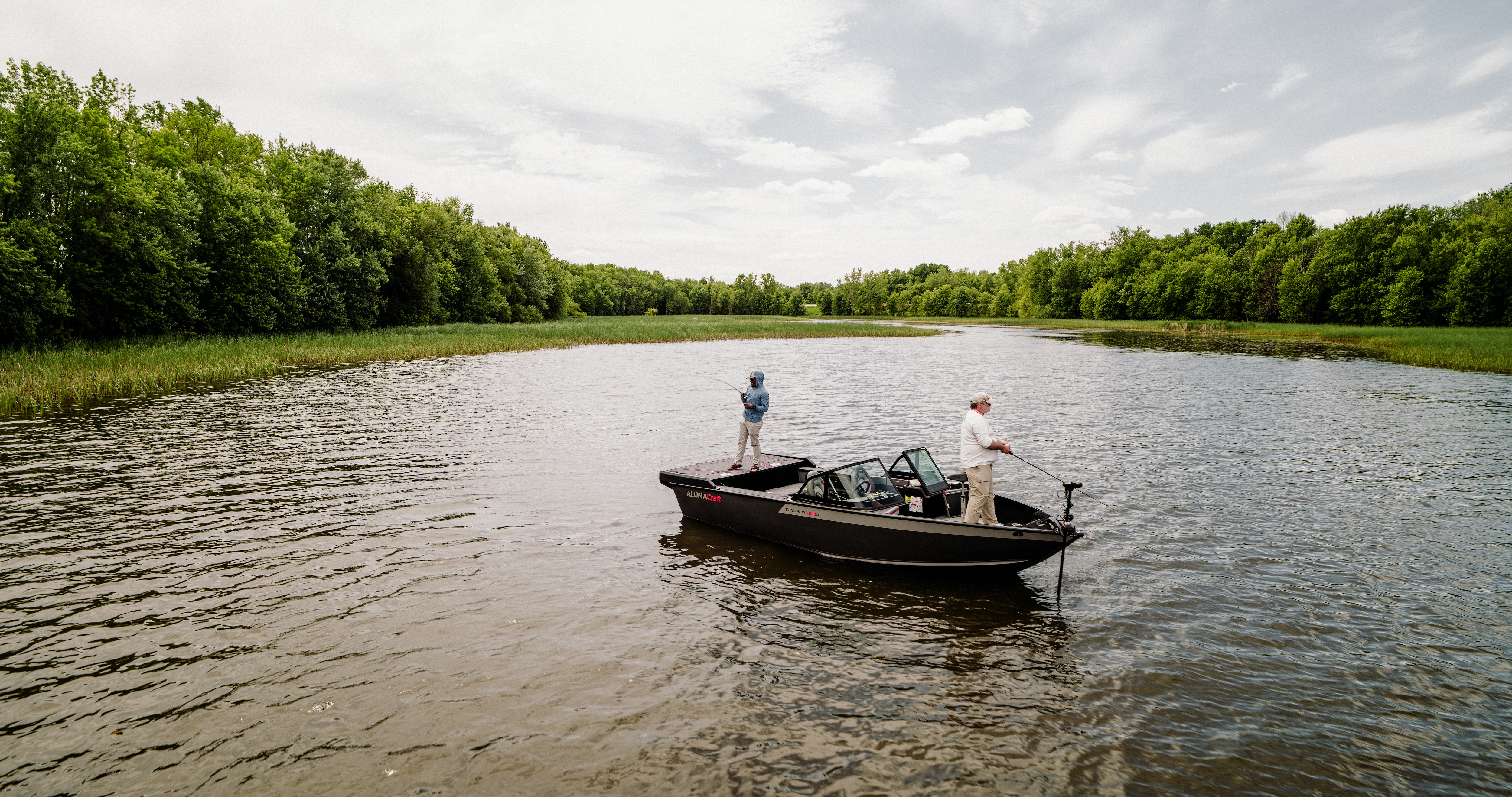 Two men fishing on an Alumacraft Trophy