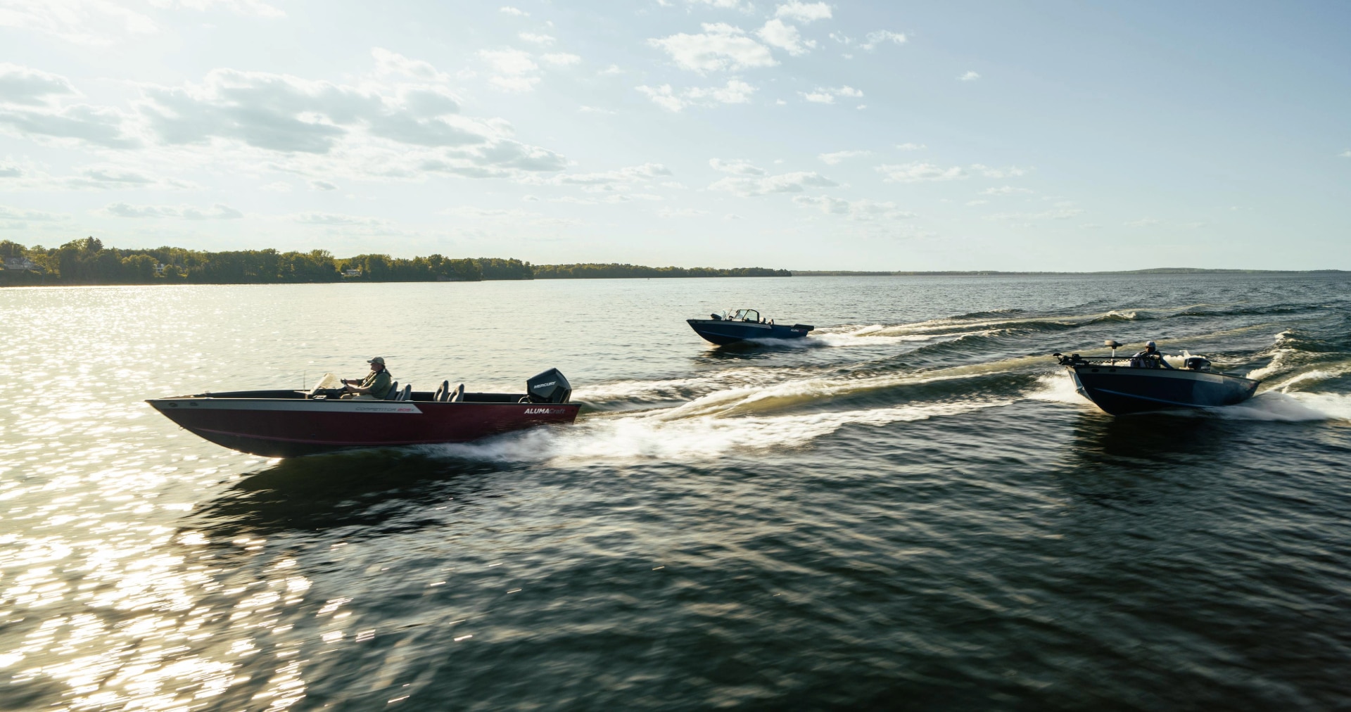 The 2025 family of Alumacraft fishing boats, sailing through the water at top speed