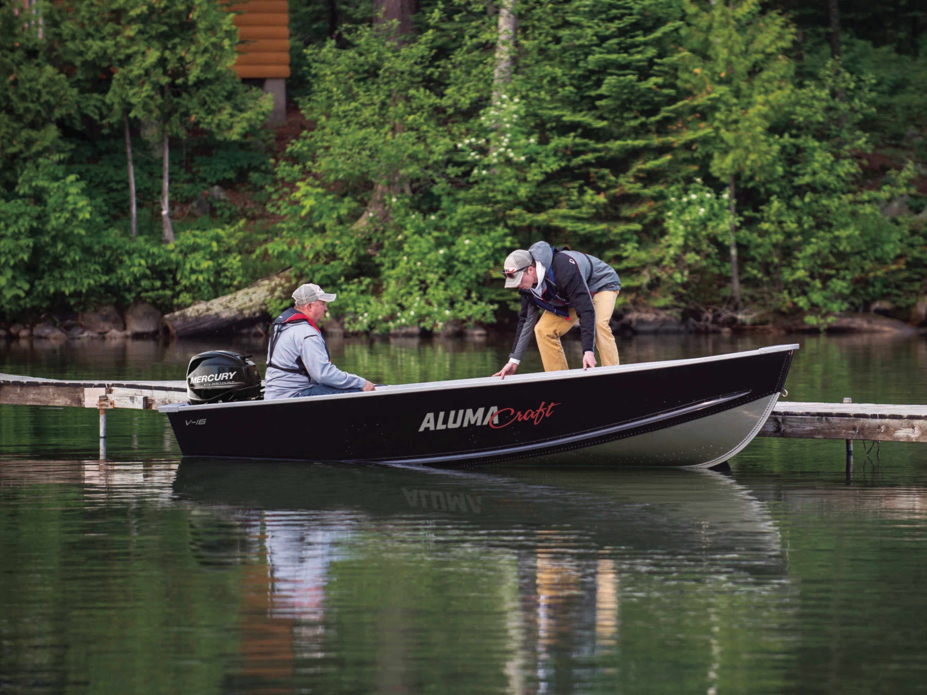 A black V-Series aluminum boat designed for utility and hunting.