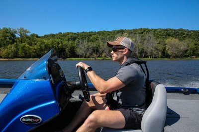 Close Up of Male Angler In Driver's Seat of Blue Pro 185 Bass Boat