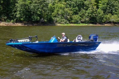 Male Angler Drives Blue Pro 185 Bass Boat on River