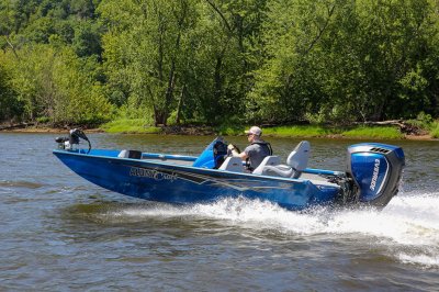 Male Angler Drives Blue Pro 185 Bass Boat on River