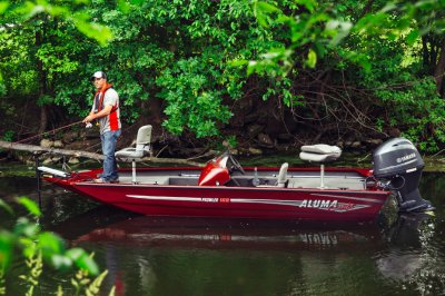 Man Fishing on Bow of Red Alumacraft Prowler 165 Bass Boat