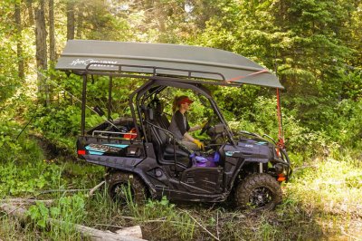 Woman Driving Utility Cart with 1036 Jon Boat Strapped to the Top
