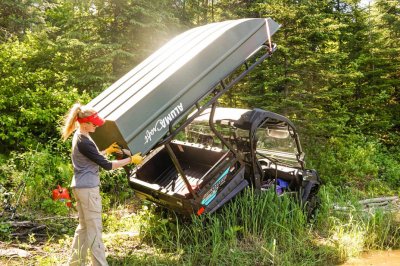 Female Angler Unloading 1036 Jon Boat From Top of Utility Cart