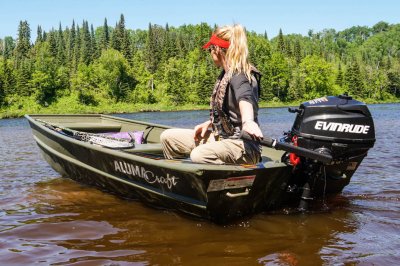 Female Angler Driving Rear Motor on Alumacraft 1036 Jon Boat