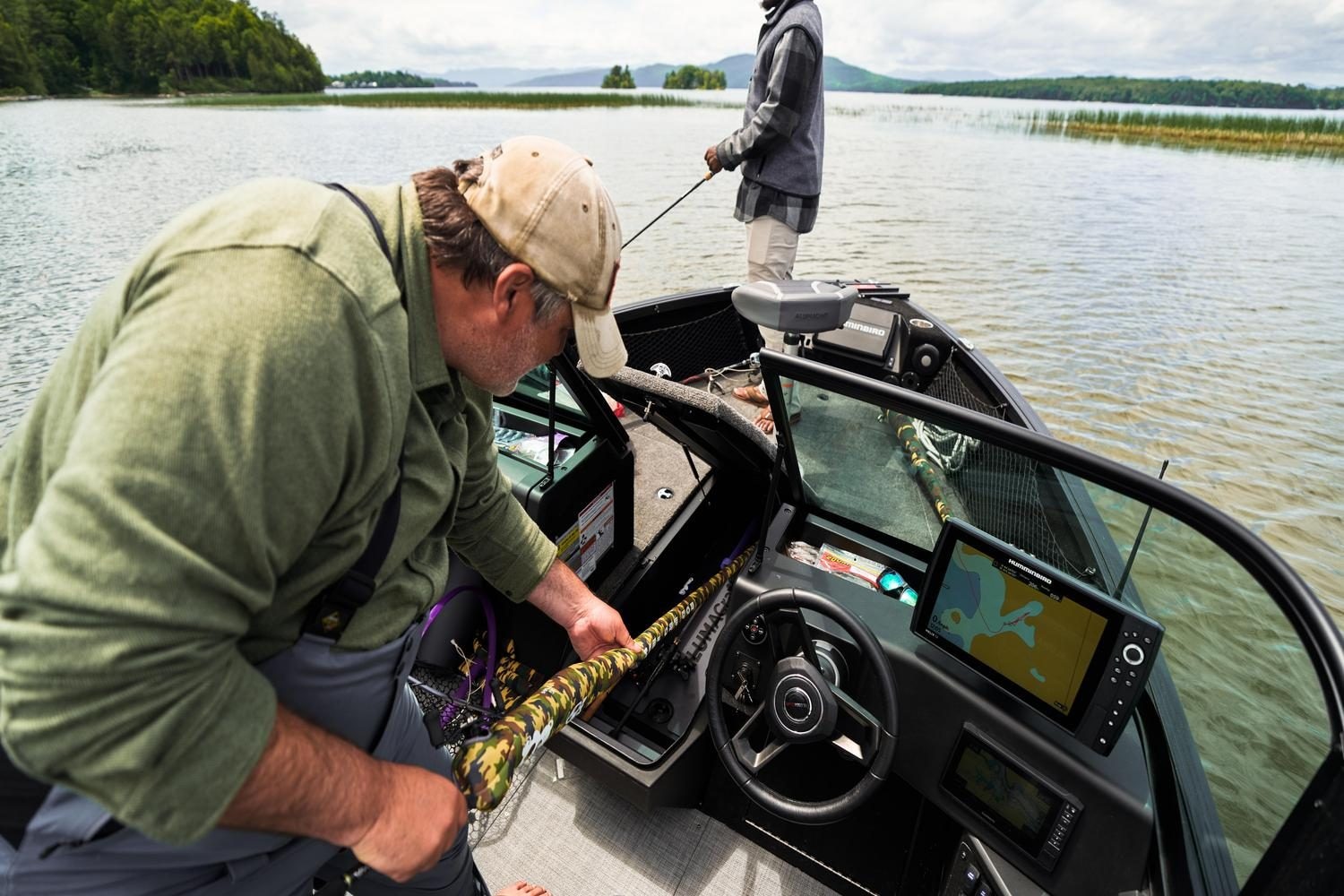 Man with his son fishing from an Alumacraft aluminum fishing boat