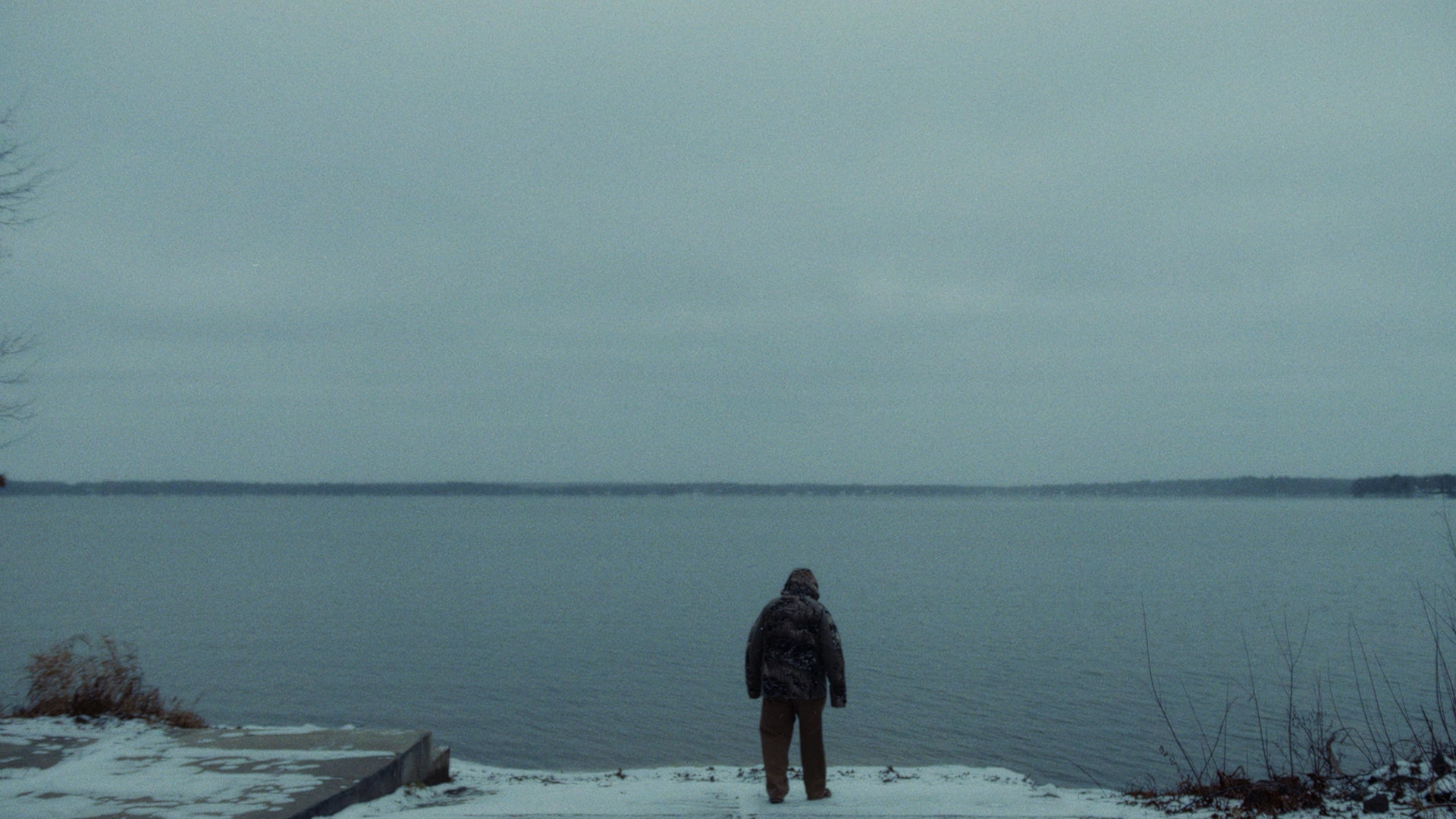 Ramsell aka “MuskieMan” in front of a lake in winter