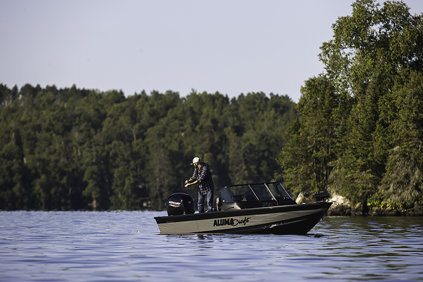 Man with his son fishing from an Alumacraft aluminum fishing boat