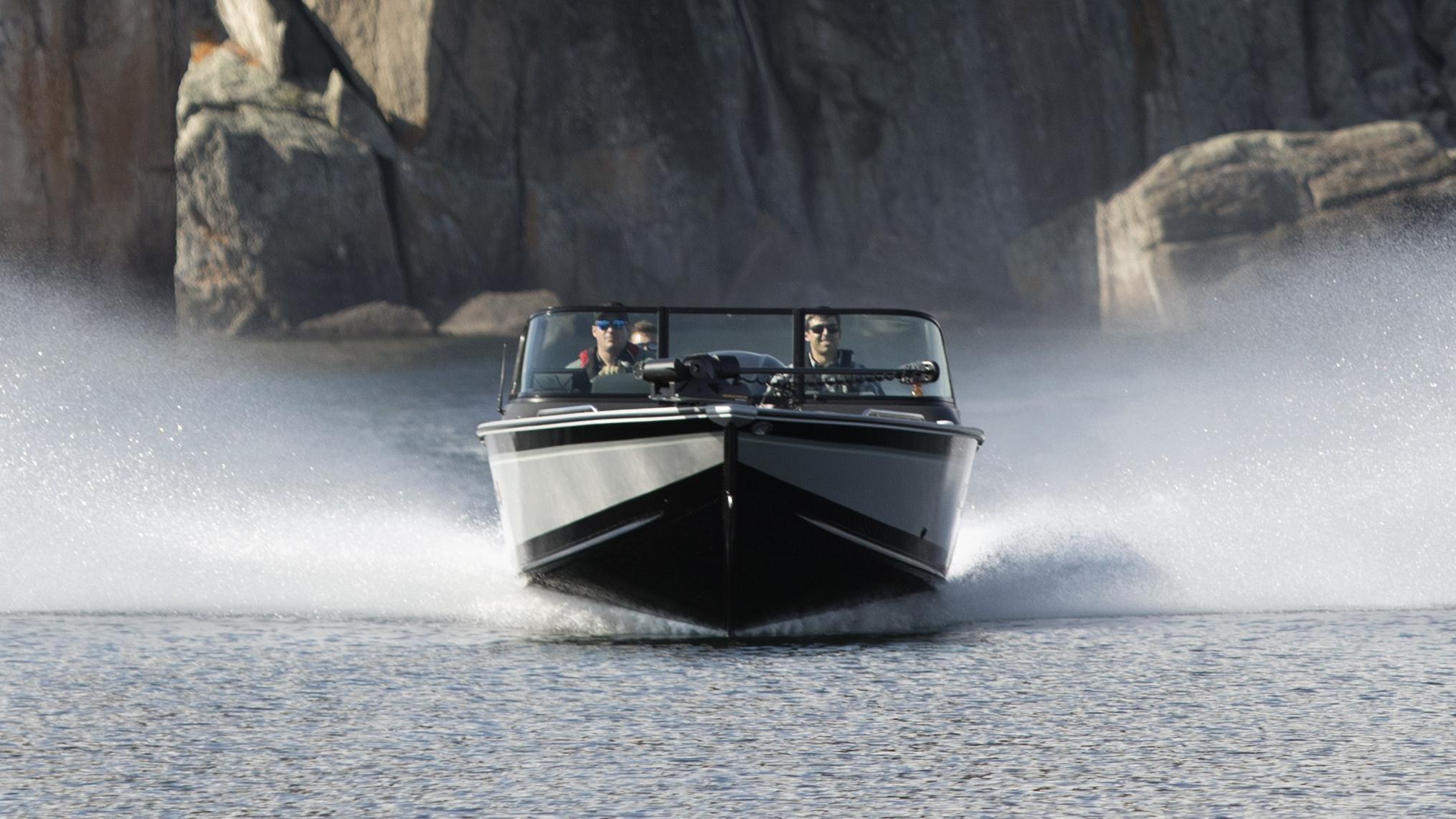 Man with his son fishing from an Alumacraft aluminum fishing boat