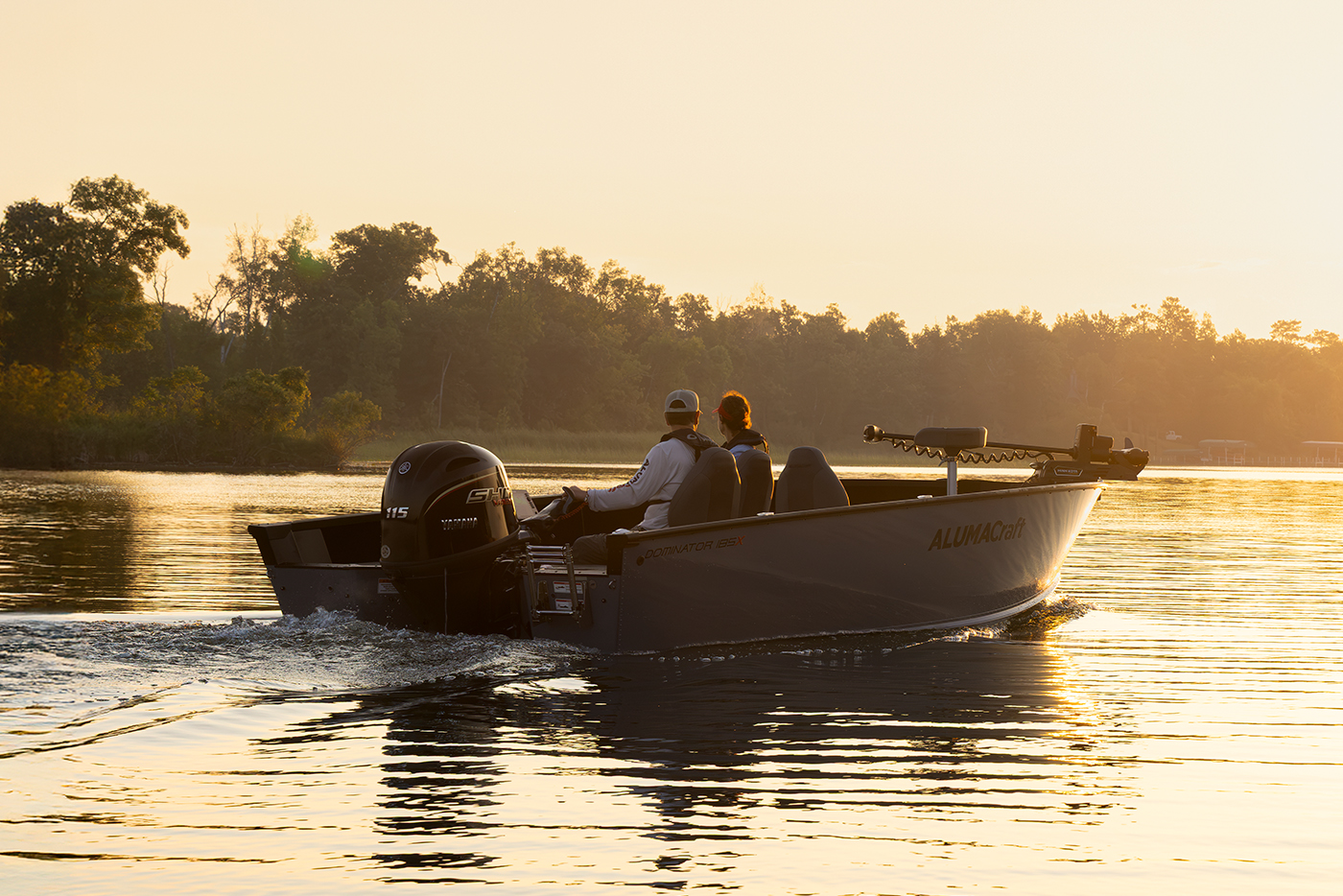 Man with his son fishing from an Alumacraft aluminum fishing boat